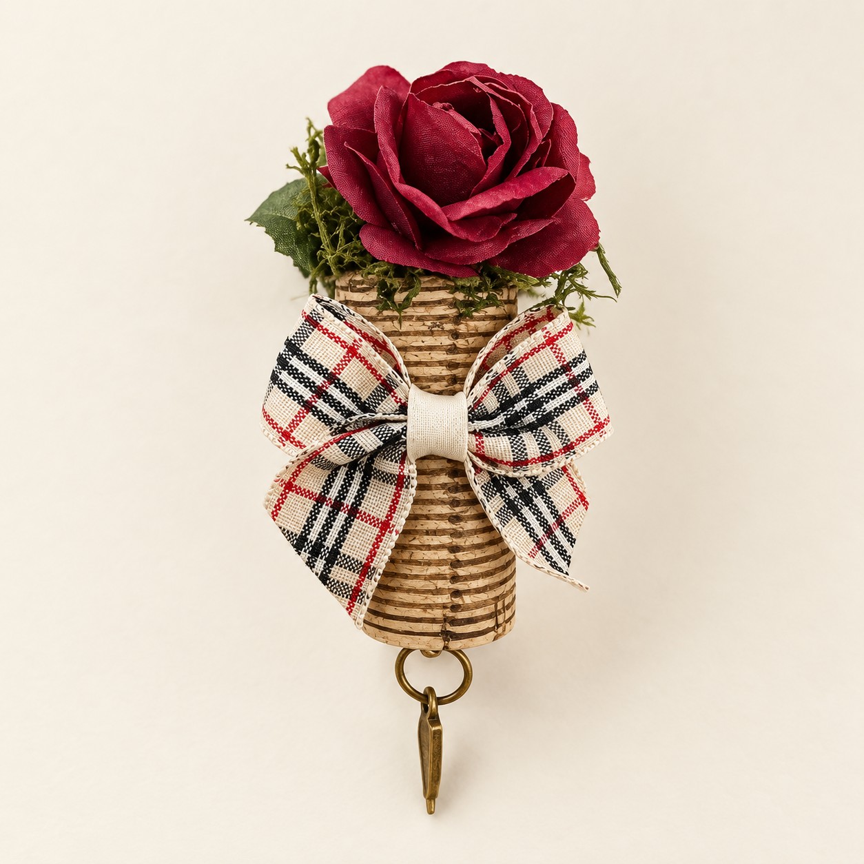 Illustrative mockup of a burgundy rose cork magnet with cream tartan bow