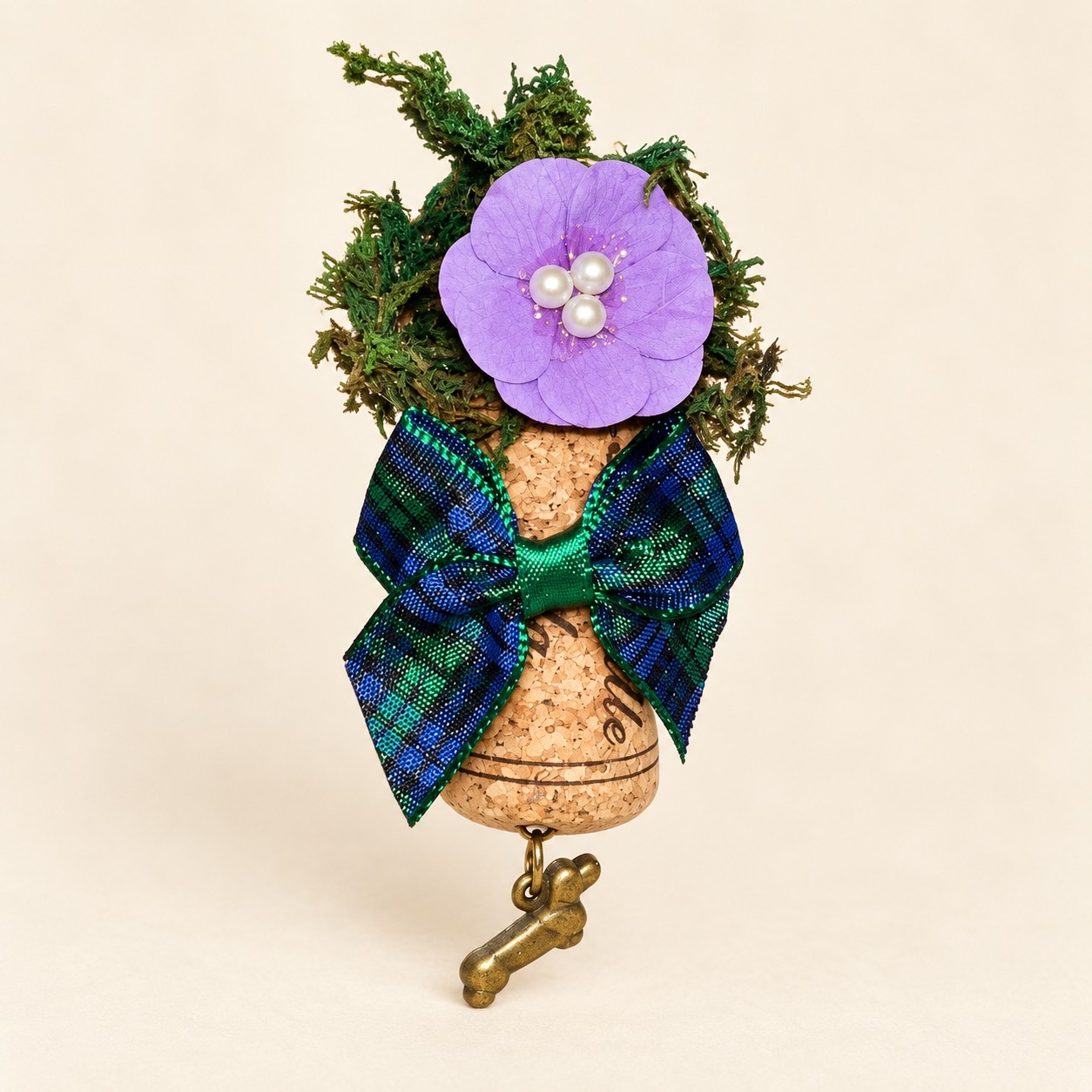 Illustrative mockup of a purple flower cork magnet with tartan bow