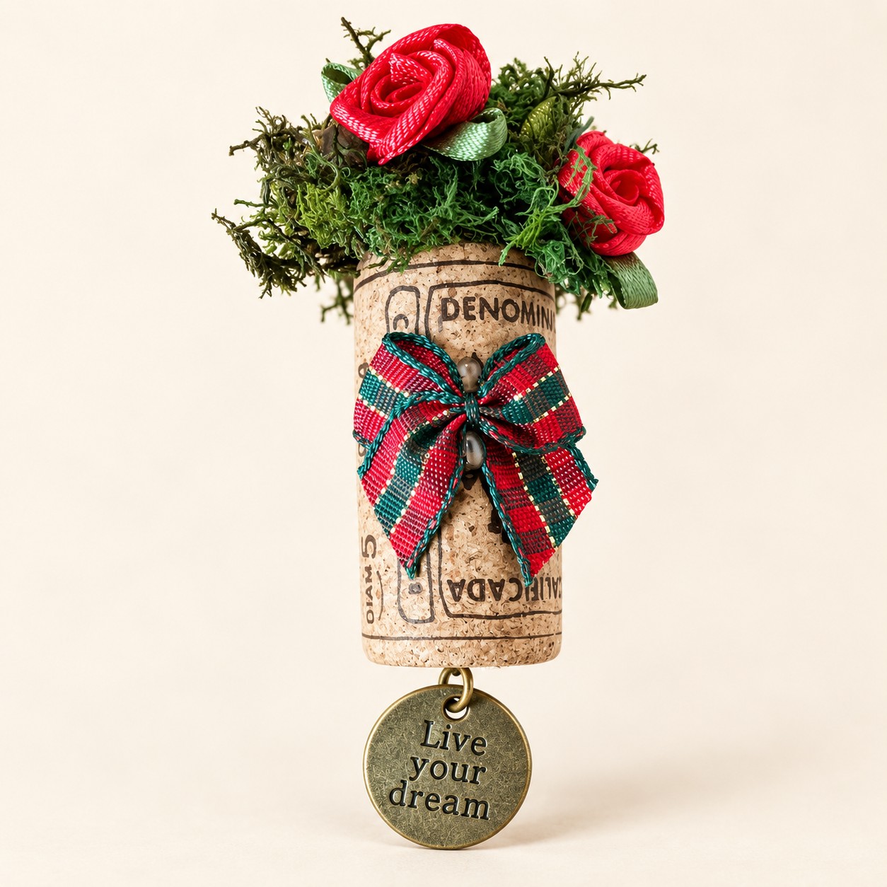AI-assisted image of a wine cork magnet with red roses, a tartan bow and a round Live your dream charm